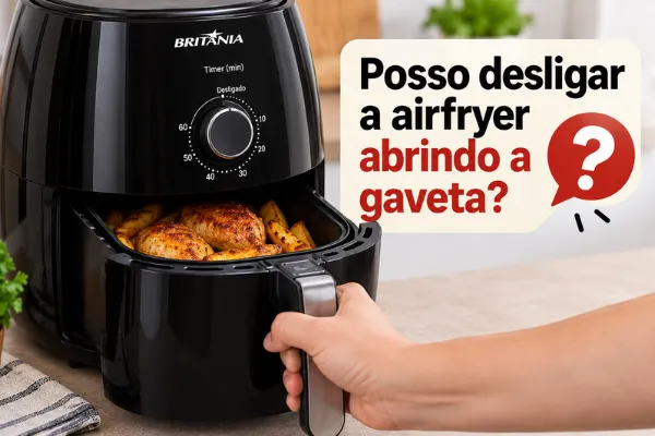 desligar airfryer abrindo a gaveta uma pessoa abrindo a airfryer com timer ligado