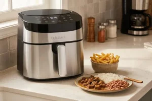 Airfryer Cuisinart vale a pena? Modelo digital em inox preparando uma refeição
